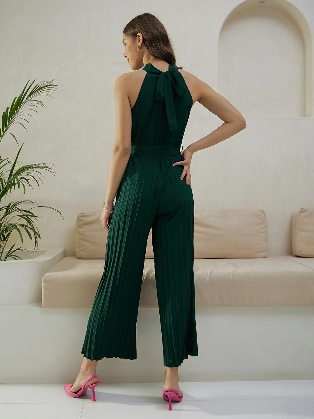 Berrylush Women Solid Green Halter Neck Sleeveless Waist Tie-Up Pleated Culotte Jumpsuit